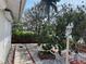 Charming front yard with a walkway, manicured bushes, and a decorative street lamp at 617 W Olympia Ave, Punta Gorda, FL 33950