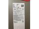 HVAC system sticker and details needing repair at 617 W Olympia Ave, Punta Gorda, FL 33950