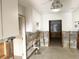 Bright kitchen space with white cabinets, awaiting a modern remodel and finishing touches at 617 W Olympia Ave, Punta Gorda, FL 33950