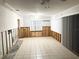 Open-concept living room with tile flooring needing remodel at 617 W Olympia Ave, Punta Gorda, FL 33950