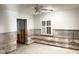 Large room with terrazzo flooring; remediation underway at 617 W Olympia Ave, Punta Gorda, FL 33950