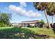 Exterior shot of backyard featuring solar panels on the roof at 6382 Cutler Ter, Port Charlotte, FL 33981