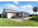 A screened-in patio area with view of the backyard at 6382 Cutler Ter, Port Charlotte, FL 33981