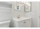 Clean bathroom featuring a modern sink, mirror, and bright lighting at 6382 Cutler Ter, Port Charlotte, FL 33981