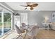 Dining area has glass table, tile floors, gray walls and a ceiling fan at 6382 Cutler Ter, Port Charlotte, FL 33981