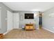 Living area features tiled floor, gray walls, and modern media center at 6382 Cutler Ter, Port Charlotte, FL 33981