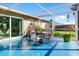 Covered patio featuring a dining table and chairs overlooking the yard at 6382 Cutler Ter, Port Charlotte, FL 33981