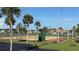 Community tennis courts surrounded by palm trees under a clear blue sky at 6382 Cutler Ter, Port Charlotte, FL 33981