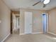 Bedroom featuring tiled floors, a ceiling fan, and multiple doors that lead to other rooms in the house at 6483 Fabian Rd, North Port, FL 34287