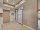 Features of the kitchen include white cabinets, an exterior door, and a refrigerator at 6483 Fabian Rd, North Port, FL 34287