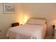 Inviting bedroom features a full bed, soft lighting, and serene decor that enhances relaxation at 6689 Gasparilla Pines Blvd, Englewood, FL 34224