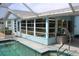 Inviting pool area featuring a covered lanai and bright, sunny exposure at 6689 Gasparilla Pines Blvd, Englewood, FL 34224