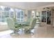 Inviting sunroom filled with natural light, tiled floors, and comfortable seating at 6689 Gasparilla Pines Blvd, Englewood, FL 34224