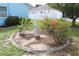 Landscaped yard with a statue, flowering shrubs and a decorative border at 6689 Gasparilla Pines Blvd, Englewood, FL 34224