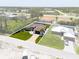 Aerial view of the home showcasing the property's well-maintained landscaping and proximity to neighborhood at 8081 Dimstead St, Port Charlotte, FL 33981