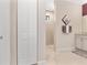View into a bathroom with double vanity, granite countertop and walk-in shower at 8081 Dimstead St, Port Charlotte, FL 33981