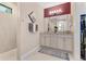 Bathroom with double vanity, granite countertop and walk-in shower with decorative accent tile at 8081 Dimstead St, Port Charlotte, FL 33981