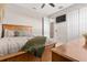 Bedroom with view into the en-suite bathroom, and ceiling fan at 8081 Dimstead St, Port Charlotte, FL 33981