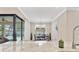 Dining area with a view of the pool, bright light, and modern decor at 8081 Dimstead St, Port Charlotte, FL 33981