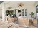 Comfortable covered patio area with seating, fans, and view of the pool at 8081 Dimstead St, Port Charlotte, FL 33981