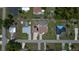 Wide angle aerial view of a neighborhood with houses, roads and plenty of trees on a sunny day at 871 Columbia St, Port Charlotte, FL 33948