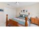 A comfortable bedroom featuring neutral walls, four poster bed and ample closet space at 871 Columbia St, Port Charlotte, FL 33948