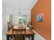Formal dining room with a large table, seating for eight, and natural light at 871 Columbia St, Port Charlotte, FL 33948