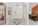 Welcoming foyer with tiled floors, double doors, and access to dining and living areas at 871 Columbia St, Port Charlotte, FL 33948