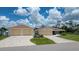 Beautiful home with a well-manicured lawn and a separate two car garage at 871 Columbia St, Port Charlotte, FL 33948