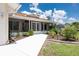 Charming home featuring a covered entrance and fresh landscaping at 871 Columbia St, Port Charlotte, FL 33948