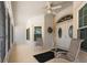 Inviting front porch with double doors, fan and relaxing seating area at 871 Columbia St, Port Charlotte, FL 33948