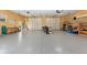 Large three-car garage with storage and workspace at 871 Columbia St, Port Charlotte, FL 33948