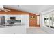 Well-lit kitchen featuring white cabinets, stainless steel appliances, and a cozy breakfast nook at 871 Columbia St, Port Charlotte, FL 33948