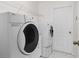 Convenient laundry room with a washer and dryer at 871 Columbia St, Port Charlotte, FL 33948