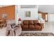 Comfortable living room featuring a leather sofa, recliner, and warm color palette at 871 Columbia St, Port Charlotte, FL 33948