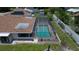 A high angle aerial view of a screened-in, in-ground swimming pool in the backyard of a single Gathering home at 871 Columbia St, Port Charlotte, FL 33948