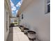 Side yard with flower beds and a pathway leading to the backyard at 871 Columbia St, Port Charlotte, FL 33948