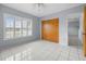 Bright bedroom with a closet and shuttered window at 879 E Seminole Dr, Venice, FL 34293