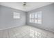A spacious bedroom with natural light and tile flooring at 879 E Seminole Dr, Venice, FL 34293