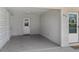 Attached carport with a side entry door, featuring a lattice wall design, providing covered parking and protection at 879 E Seminole Dr, Venice, FL 34293