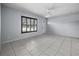 A bright and spacious room with tile flooring and fresh paint, offering versatility and lots of natural light at 879 E Seminole Dr, Venice, FL 34293