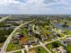A residential area with a single-Gathering home surrounded by lush landscaping, highlighting location and surroundings at 1275 Blue Lake Cir, Punta Gorda, FL 33983
