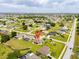 A residential area with a single-Gathering home surrounded by lush landscaping, highlighting location and surroundings at 1275 Blue Lake Cir, Punta Gorda, FL 33983