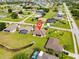 A residential area with a house, pool and lush landscaping, highlighting location and surroundings at 1275 Blue Lake Cir, Punta Gorda, FL 33983