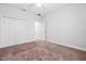 This spacious bedroom features neutral walls, carpeting, and ample closet space at 1275 Blue Lake Cir, Punta Gorda, FL 33983