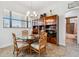 Cozy dining area with a glass-top table, wood chairs, and natural light at 1275 Blue Lake Cir, Punta Gorda, FL 33983