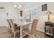 Elegant dining room featuring a marble-top table and upholstered chairs at 1275 Blue Lake Cir, Punta Gorda, FL 33983