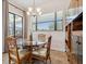Bright dining area with a glass-top table, detailed chairs, and window view at 1275 Blue Lake Cir, Punta Gorda, FL 33983