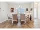 Inviting dining area with a large window and modern chandelier at 1275 Blue Lake Cir, Punta Gorda, FL 33983