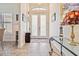 Bright entryway with tile flooring, a glass-topped table, and double front doors at 1275 Blue Lake Cir, Punta Gorda, FL 33983